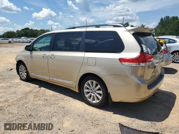2014 Toyota Sienna XLE with VIN 5TDYK3DC8ES414814, listed as a Copart auction lot 64577875 with 111,675 mi miles and Salvage title. Bid and sale history available at DreamBid. Image 2.