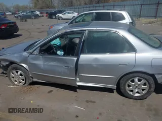 2002 Honda Accord EX z VIN JHMCG56612C026303, wystawiony jako IAAI lot #41992812 z przebiegiem 153 021 mil mil oraz . Historia ofert i sprzedaży dostępna na DreamBid. Obrazek 15.