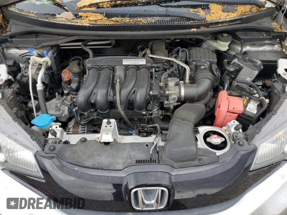 2015 Honda Fit LX z VIN 3HGGK5H58FM768130, wystawiony jako Copart lot #58184435 z przebiegiem 67 968 mil mil oraz Szkoda całkowita • Salvage title. Historia ofert i sprzedaży dostępna na DreamBid. Obrazek 11.