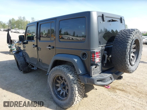 2015 Jeep Wrangler Unlimited Willys Wheeler with VIN 1C4BJWDG9FL750049, listed as a IAAI auction lot 42136188 with 115,328 mi miles and . Bid and sale history available at DreamBid. Image 3.