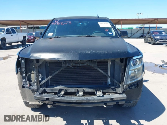 2015 Chevrolet Tahoe LS with VIN 1GNSCAKC5FR645736, listed as a IAAI auction lot 42064623 with 223,149 mi miles and . Bid and sale history available at DreamBid. Image 13.