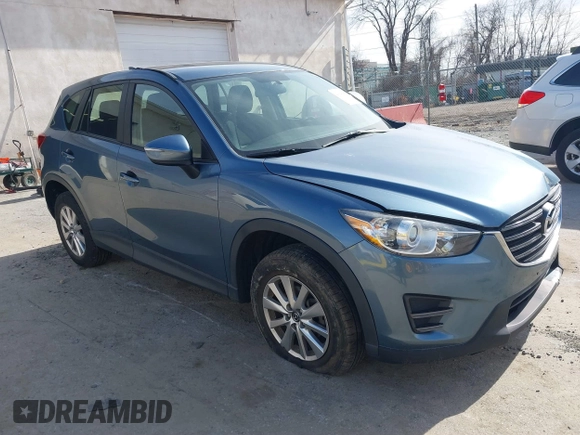 2016 Mazda CX-5 Sport with VIN JM3KE4BY0G0746034, listed as a IAAI auction lot 41842894 with 92,801 mi miles. Bid and sale history available at carsss.com. Image 1.