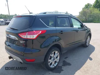 2015 Ford Escape Titanium with VIN 1FMCU9J96FUB58519, listed as a IAAI auction lot 42429369 with 125,541 mi miles and . Bid and sale history available at DreamBid. Image 4.