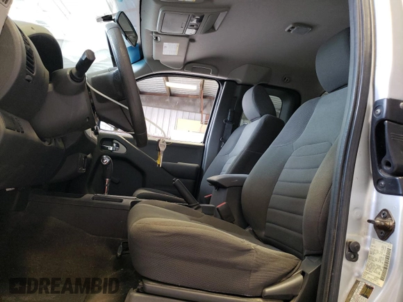 2015 Nissan Frontier SV with VIN 1N6BD0CT1FN713999, listed as a Copart auction lot 62053944 with 104,667 mi miles and Salvage title. Bid and sale history available at DreamBid. Image 7.