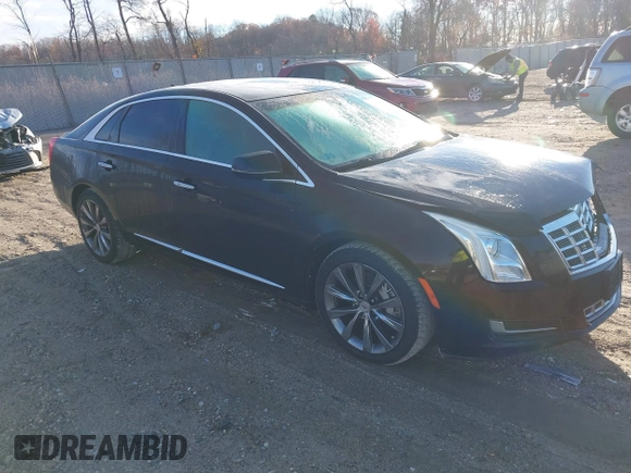 2013 Cadillac XTS z VIN 2G61N5S32D9238652, wystawiony jako IAAI lot #40966692 z przebiegiem 90 834 mil mil oraz . Historia ofert i sprzedaży dostępna na DreamBid. Obrazek 1.