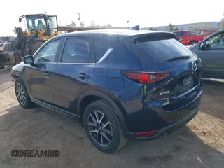 2018 Mazda CX-5 Touring z VIN JM3KFACM0J1389057, wystawiony jako IAAI lot #40922679 z przebiegiem 140 026 mil mil oraz . Historia ofert i sprzedaży dostępna na DreamBid. Obrazek 3.