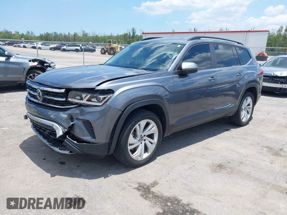 2021 Volkswagen Atlas SE with VIN 1V2HR2CA9MC585740, listed as a IAAI auction lot 42279757 with 64,995 mi miles and . Bid and sale history available at DreamBid. Image 2.