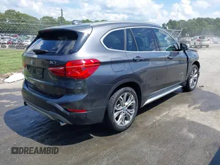 2017 BMW X1 xDrive28i with VIN WBXHT3Z38H4A55086, listed as a IAAI auction lot 42459276 with 101,907 mi miles and . Bid and sale history available at DreamBid. Image 4.