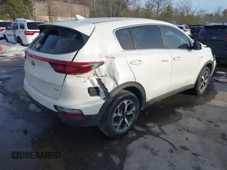 2021 Kia Sportage LX with VIN KNDPMCACXM7901175, listed as a IAAI auction lot 41588890 with 94,404 mi miles and . Bid and sale history available at carsss.com. Image 4.