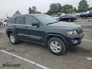 2014 Jeep Grand Cherokee Laredo with VIN 1C4RJEAG6EC359646, listed as a Copart auction lot 57081474 with 110,401 mi miles and Salvage Title. Bid and sale history available at carsss.com. Image 4.