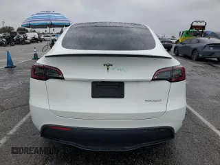 2023 Tesla Model Y Performance with VIN 7SAYGDEF1PF809654, listed as a Copart auction lot 43981915 with 16,401 mi miles and Salvage Title. Bid and sale history available at DreamBid. Image 6.