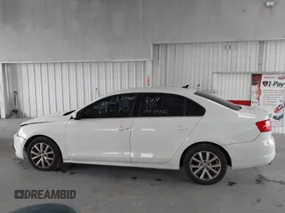 2014 Volkswagen Jetta SE z VIN 3VWD17AJ3EM265396, wystawiony jako IAAI lot #42434771 z przebiegiem 114 931 mil mil oraz . Historia ofert i sprzedaży dostępna na DreamBid. Obrazek 14.