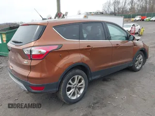 2017 Ford Escape SE with VIN 1FMCU9GD5HUA57132, listed as a IAAI auction lot 42075470 with 106,271 mi miles. Bid and sale history available at carsss.com. Image 4.