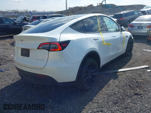 2023 Tesla Model Y Long Range with VIN 7SAYGDEE4PF780951, listed as a IAAI auction lot 41856461 with 63,317 mi miles. Bid and sale history available at carsss.com. Image 4.
