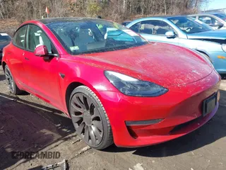 2021 Tesla Model 3 Performance z VIN 5YJ3E1EC5MF061178, wystawiony jako IAAI lot #41600498 z przebiegiem 30 761 mil mil oraz . Historia ofert i sprzedaży dostępna na DreamBid. Obrazek 1.