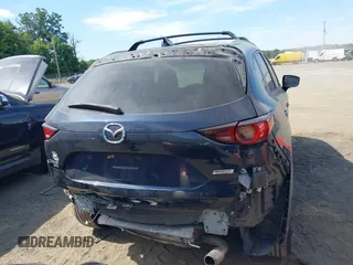 2017 Mazda CX-5 Touring z VIN JM3KFBCL5H0133493, wystawiony jako IAAI lot #39666644 z przebiegiem 125 048 mil mil oraz . Historia ofert i sprzedaży dostępna na DreamBid. Obrazek 17.