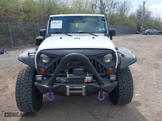 2012 Jeep Wrangler Unlimited Sahara with VIN 1C4BJWEG9CL220965, listed as a IAAI auction lot 41902295 with 120,492 mi miles. Bid and sale history available at carsss.com. Image 6.