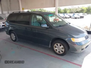 2004 Honda Odyssey EX with VIN 5FNRL18624B056333, listed as a IAAI auction lot 42143860 with 165,687 mi miles and . Bid and sale history available at DreamBid. Image 1.