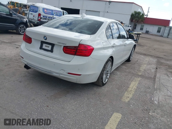 2012 BMW 3 Series 328i with VIN WBA3A5C57CF347953, listed as a IAAI auction lot 42176008 with 140,598 mi miles and . Bid and sale history available at carsss.com. Image 4.