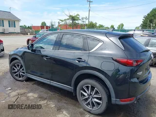 2018 Mazda CX-5 Grand Touring z VIN JM3KFBDM5J0307785, wystawiony jako IAAI lot #42302609 z przebiegiem 81 974 mil mil oraz . Historia ofert i sprzedaży dostępna na DreamBid. Obrazek 3.