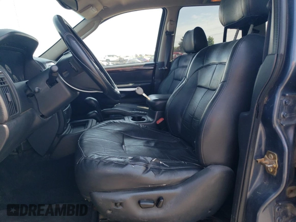 2004 Jeep Grand Cherokee Limited z VIN 1J4GW58S34C330987, wystawiony jako Copart lot #59089675 z przebiegiem 249 335 mil mil oraz Szkoda całkowita • Salvage title. Historia ofert i sprzedaży dostępna na DreamBid. Obrazek 7.