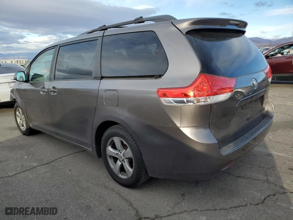 2011 Toyota Sienna LE AAS with VIN 5TDKK3DC8BS130634, listed as a Copart auction lot 41613935 with 173,922 mi miles and Salvage Title. Bid and sale history available at carsss.com. Image 2.