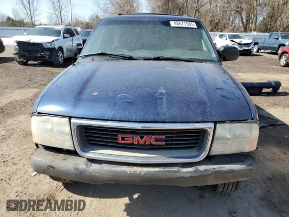 2003 GMC Jimmy z VIN 1GKCT18X43K110056, wystawiony jako Copart lot #48671585 z przebiegiem 272 867 mil mil oraz Czysty tytuł • Clean title. Historia ofert i sprzedaży dostępna na DreamBid. Obrazek 5.