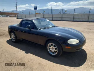 1999 Mazda MX-5 Miata with VIN JM1NB3535X0119662, listed as a Copart auction lot 61870445 with 84,787 mi miles and Clean title. Bid and sale history available at DreamBid. Image 4.