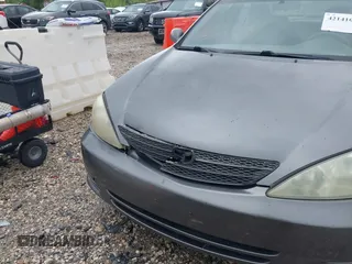 2004 Toyota Camry LE with VIN 4T1BE32K64U868802, listed as a IAAI auction lot 42141061 with 254,215 mi miles. Bid and sale history available at carsss.com. Image 6.