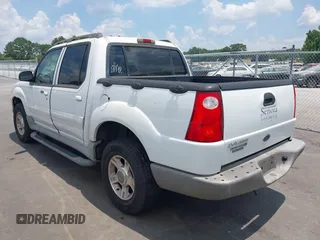 2003 Ford Explorer Sport Trac XLS z VIN 1FMZU67E63UB48999, wystawiony jako IAAI lot #42696231 z przebiegiem 86 900 mil mil oraz . Historia ofert i sprzedaży dostępna na DreamBid. Obrazek 3.