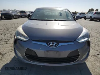 2012 Hyundai Veloster w/Gray Int z VIN KMHTC6AD9CU079542, wystawiony jako Copart lot #55998045 z przebiegiem 98 065 mil mil oraz Szkoda całkowita • Salvage title. Historia ofert i sprzedaży dostępna na DreamBid. Obrazek 5.