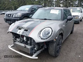 2017 MINI Hardtop 4 Door Cooper S z VIN WMWXU3C58H2D33073, wystawiony jako IAAI lot #41913081 z przebiegiem 51 631 mil mil oraz . Historia ofert i sprzedaży dostępna na DreamBid. Obrazek 18.