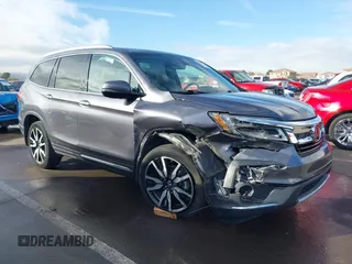 2019 Honda Pilot Touring 7-Passenger z VIN 5FNYF5H65KB020420, wystawiony jako IAAI lot #41575972 z przebiegiem 48 950 mil mil oraz . Historia ofert i sprzedaży dostępna na DreamBid. Obrazek 1.