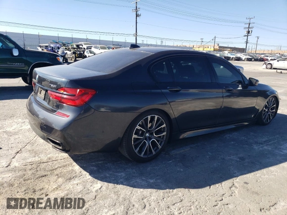 2019 BMW 7 Series 750i with VIN WBA7F0C56KGM25430, listed as a Copart auction lot 42048135 with 74,717 mi miles and Salvage title. Bid and sale history available at DreamBid. Image 3.