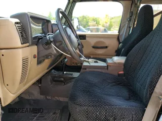 2002 Jeep Wrangler Sport с VIN 1J4FA49SX2P738105, выставлен на аукционе Copart как лот 60320775 с пробегом 402 518 миль миль и Списание • Salvage title. История ставок и продаж доступна на DreamBid. Изображение 7.
