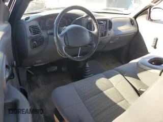 2002 Ford F-150 XL with VIN 1FTRF18232NA58109, listed as a Copart auction lot 79080674 with 148,213 mi miles and Salvage title. Bid and sale history available at DreamBid. Image 8.