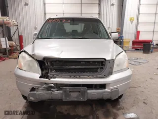 2005 Honda Pilot EX-L with VIN 2HKYF18575H557005, listed as a IAAI auction lot 41647830 with 245,992 mi miles. Bid and sale history available at carsss.com. Image 12.