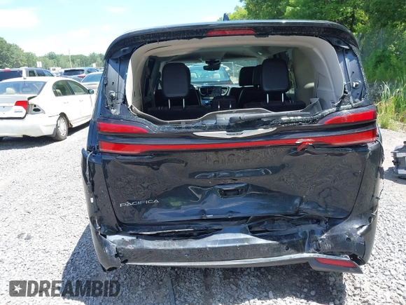 2023 Chrysler Pacifica Touring L with VIN 2C4RC1BG2PR534194, listed as a IAAI auction lot 42613934 with 69,896 mi miles and . Bid and sale history available at DreamBid. Image 6.