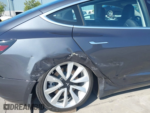 2018 Tesla Model 3 Long Range Battery with VIN 5YJ3E1EA4JF024102, listed as a IAAI auction lot 42100621 with 86,298 mi miles and . Bid and sale history available at DreamBid. Image 6.