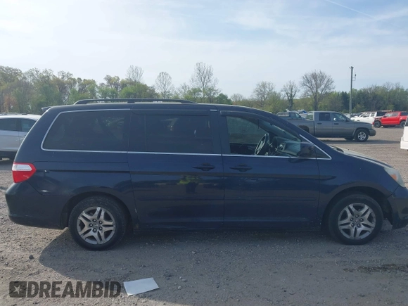 2005 Honda Odyssey EX with VIN 5FNRL38455B135555, listed as a IAAI auction lot 42080079 with 149,468 mi miles and . Bid and sale history available at carsss.com. Image 13.