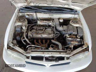 2001 Mitsubishi Mirage ES z VIN JA3AY26CX1U013535, wystawiony jako Copart lot #57664885 z przebiegiem 159 095 mil mil oraz Szkoda całkowita • Salvage title. Historia ofert i sprzedaży dostępna na DreamBid. Obrazek 11.