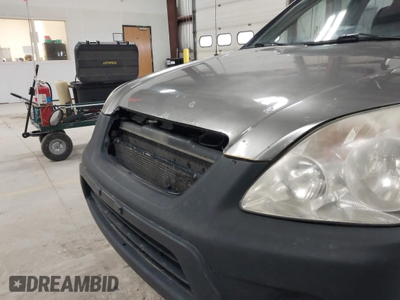 2006 Honda CR-V LX with VIN JHLRD785X6C053853, listed as a IAAI auction lot 42018895 with 246,316 mi miles and . Bid and sale history available at carsss.com. Image 16.