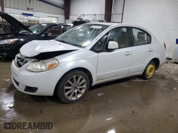 2011 Suzuki SX4 LE z VIN JS2YC5A29B6302397, wystawiony jako Copart lot #82691304 z przebiegiem 251 382 mil mil oraz Szkoda całkowita • Salvage title. Historia ofert i sprzedaży dostępna na DreamBid. Obrazek 1.