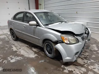 2011 Kia Rio LX with VIN KNADH4A3XB6858793, listed as a IAAI auction lot 41542266 with 166,892 mi miles. Bid and sale history available at carsss.com. Image 1.