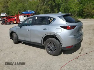 2021 Mazda CX-5 Touring z VIN JM3KFBCM1M0343804, wystawiony jako Copart lot #56194795 z przebiegiem 100 039 mil mil oraz Tytuł czysty. Historia ofert i sprzedaży dostępna na DreamBid. Obrazek 2.