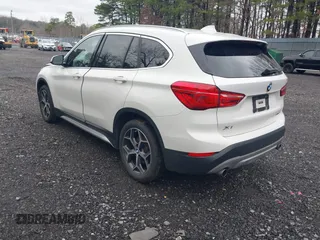 2018 BMW X1 xDrive28i with VIN WBXHT3C36J5L32162, listed as a IAAI auction lot 41802315 with 80,422 mi miles. Bid and sale history available at carsss.com. Image 3.
