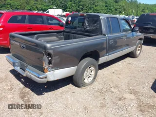 2001 Dodge Dakota Sport z VIN 1B7HL2ANX1S297770, wystawiony jako IAAI lot #42309715 z przebiegiem 279 458 mil mil oraz . Historia ofert i sprzedaży dostępna na DreamBid. Obrazek 4.
