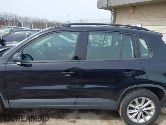 2018 Volkswagen Tiguan with VIN WVGBV7AX3JK002325, listed as a IAAI auction lot 41960059 with 57,619 mi miles and . Bid and sale history available at DreamBid. Image 14.