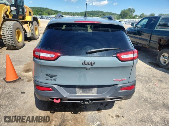 2015 Jeep Cherokee Trailhawk with VIN 1C4PJMBS4FW687328, listed as a Copart auction lot 58927765 with 119,483 mi miles and Non repairable. Bid and sale history available at DreamBid. Image 6.