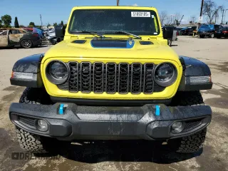 2024 Jeep Wrangler Rubicon z VIN 1C4RJXR64RW193946, wystawiony jako Copart lot #51693105 z przebiegiem 4 863 mil mil oraz Szkoda całkowita • Salvage title. Historia ofert i sprzedaży dostępna na DreamBid. Obrazek 5.